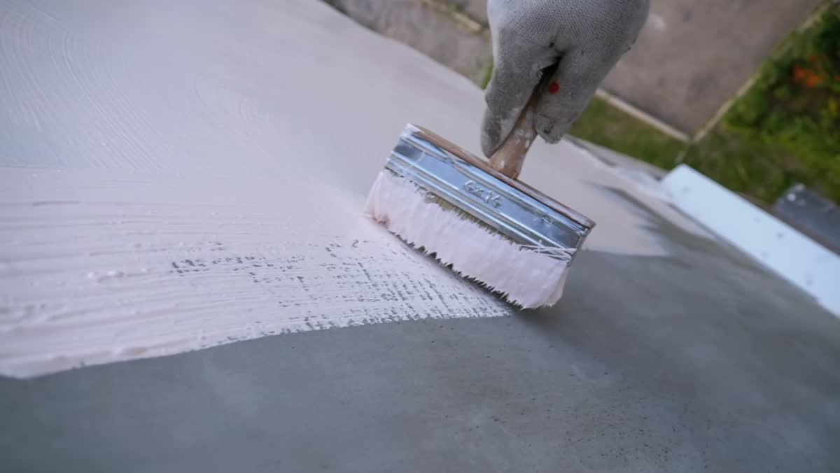 Fresh coat of paint being applied to an interior wall